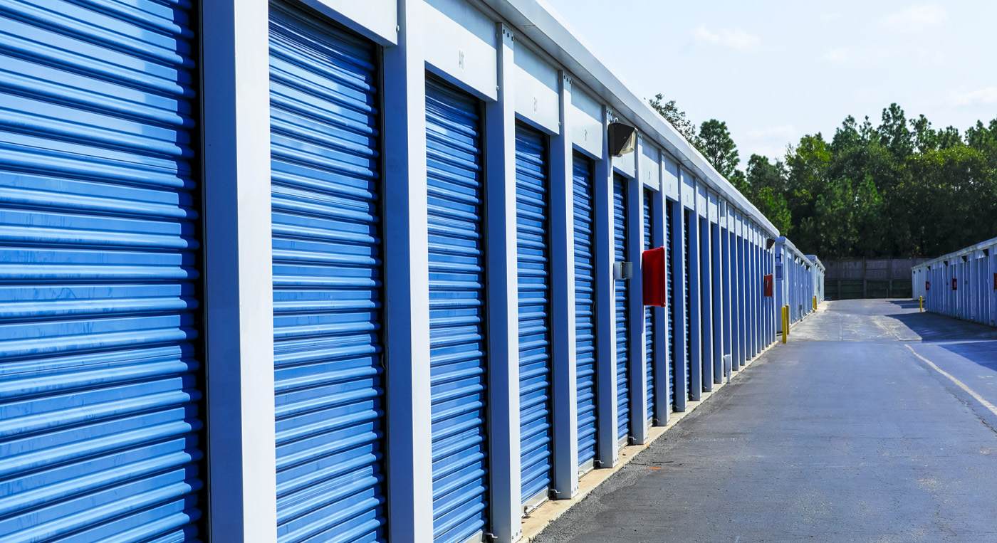 A self-storage facility with outdoor rows of storage units.