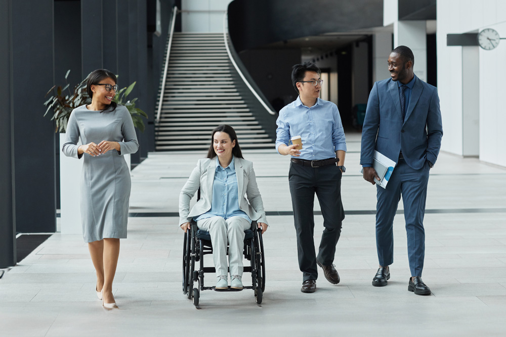 Young professionals walking through an upscale office lobby together